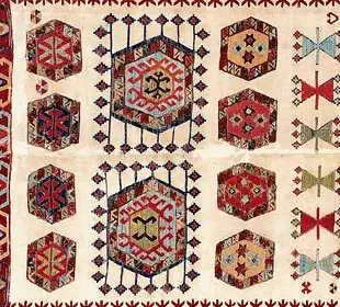 One hexagonal medallion from the field of a flatweave, in red, blue and ochre on cream
